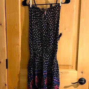 Black and white romper with pink and blue accents